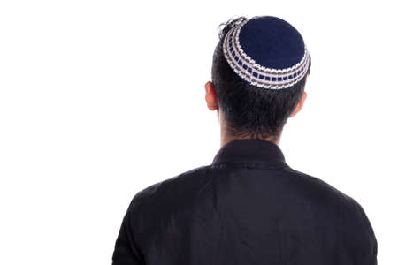 Man wearing kipa seen from the back, white background. religious person seen from behind.の写真素材