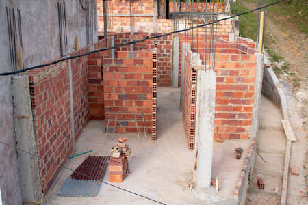 House under construction, putting up walls and creating rooms.の写真素材