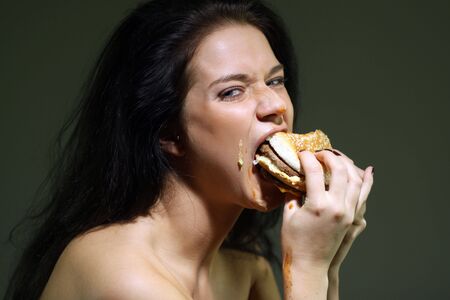 Woman Eating Burger の写真素材