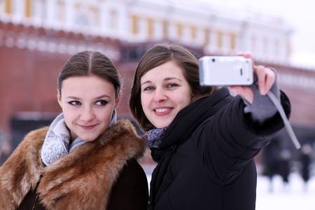 Two girls tourists are photographed in Moscow (Russia)の写真素材