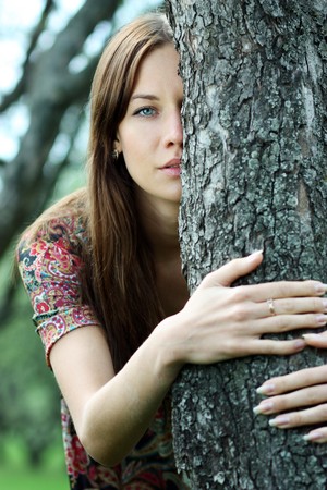 Beautiful woman walking in parkの写真素材