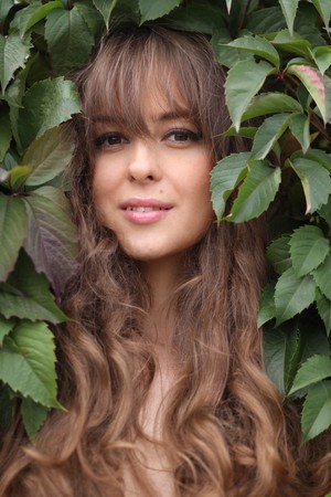 Portrait of the girl in green foliage の写真素材