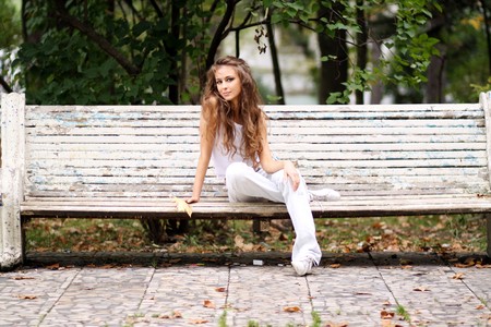 Beautiful young woman in autumn park の写真素材