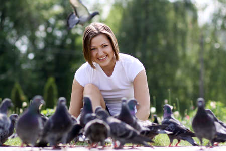 Beautiful young woman and doveの写真素材