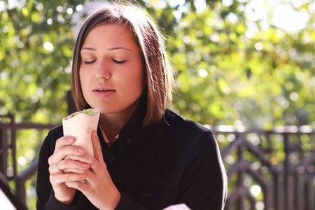 Woman Eating Lunch At A Cafe の写真素材