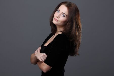 Beautiful young woman in grey background
