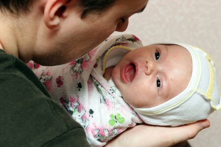 father and baby play in the homeï¿½