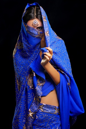 young pretty woman in indian blue dressの写真素材