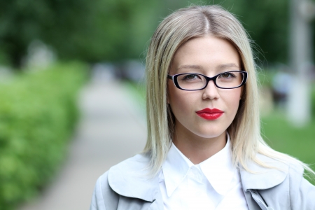 Beautiful young woman in sunglasses. Outdoor portrait の写真素材