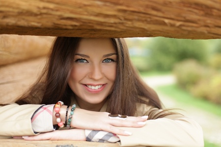 Beautiful young woman in autumn parkの写真素材