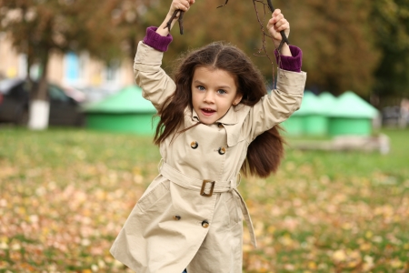 little girl in the autumn parkの写真素材