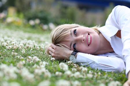 Portrait of beautiful blond in spring blossom の写真素材