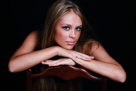 Sexy blond in black lingerie over dark backgroundの写真素材