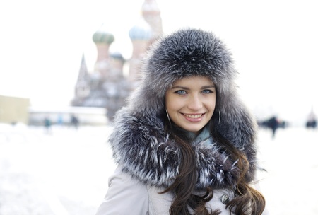 Portrait of a young woman on the background of a winter cityの写真素材