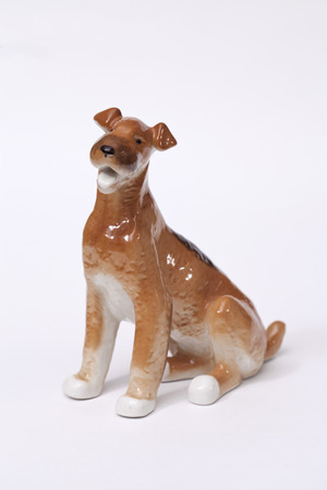 fox terrier Dog ceramic figurine, isolated on white の写真素材