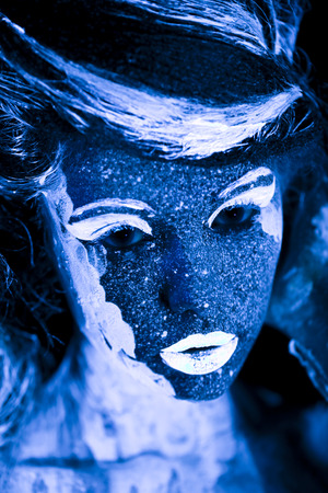 Body art glowing in ultraviolet lightの写真素材