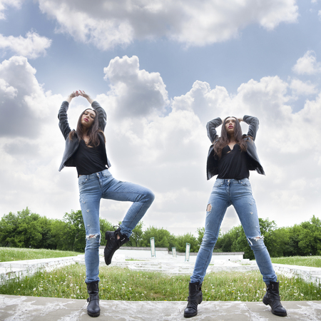 Full length portrait of a beautiful women in blue jeansの写真素材