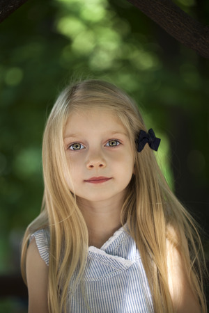 Portrait of a beautiful blonde little girlの写真素材