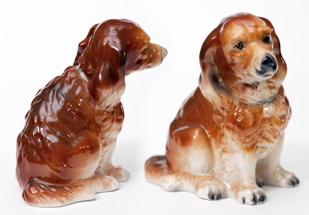 English Shepherd puppy. Ceramic figurine, dog breed isolated on whiteの写真素材