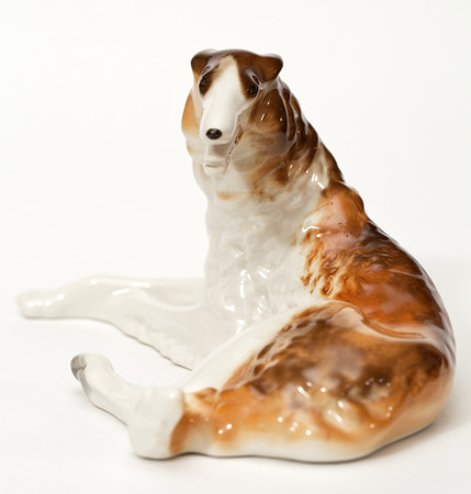 Hound hound. Ceramic figurine, dog breed isolated on whiteの写真素材