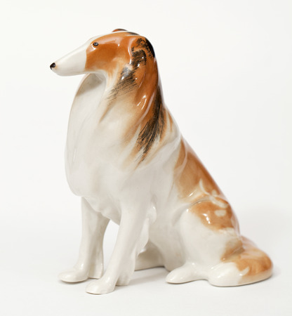 Collie. Ceramic figurine, dog breed isolated on whiteの写真素材