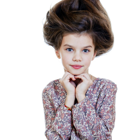 Portrait of beautiful little girl, studio on white backgroundの写真素材