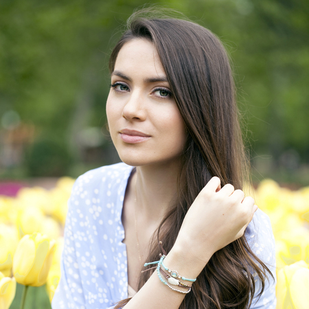 Beautiful young woman with tulipsの写真素材