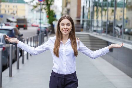 Close up Portrait, young business woman in white shirt on summer street cityの写真素材
