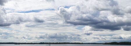 Overcast clouds. Storm sky, rainy clouds over horizonの写真素材