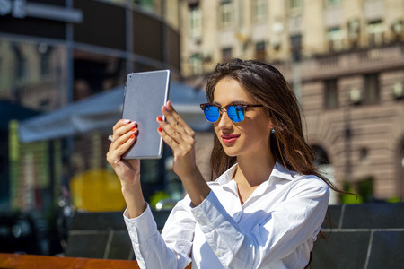 Young Beautiful business woman reading notepad