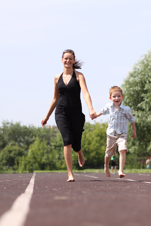 Happy mother and her little son outdoors sessionの写真素材