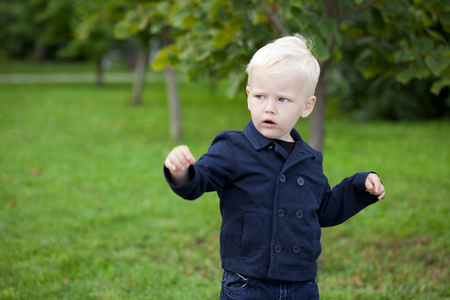 Portrait of a little boy of two years, outdoorsの写真素材