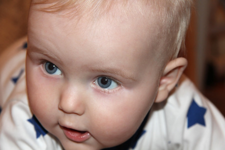 Ten months old baby blonde boyの写真素材