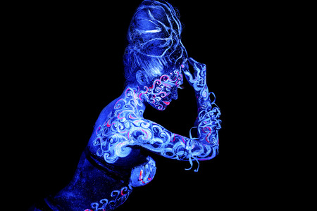 Air woman. Body art glowing in ultraviolet light, four elements, isolated on black backgroundの写真素材