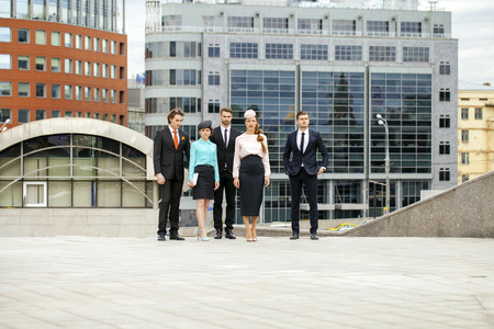 Business people are walking down the street on a background of business centersの写真素材