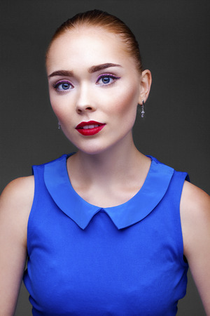 Make Up. Beautiful Blonde Girl. Isolated on dark gray backgroundの写真素材