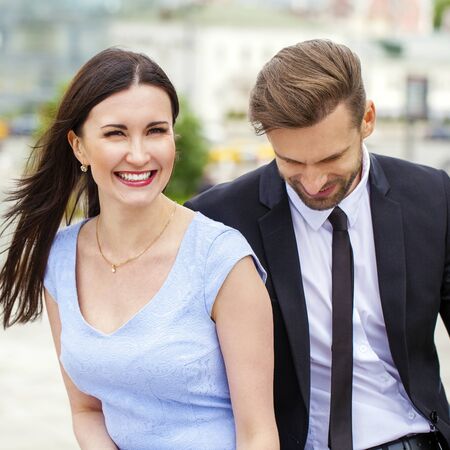 Close portrait of a smiling attractive business young couple working together, outdoor shootの写真素材