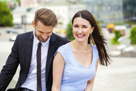 Close portrait of a smiling attractive business young couple working together, outdoor shootの写真素材