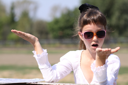 Beautiful little girl in sunglassesの写真素材