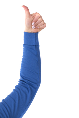 Woman hand with thumb up isolated on white backgroundの写真素材