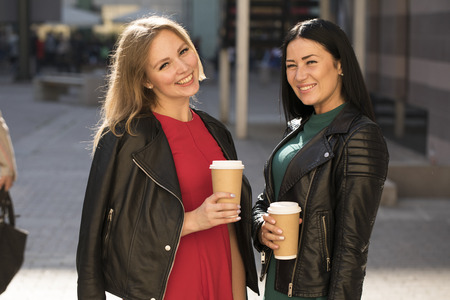Two cheerful women, summer street outdoorsの写真素材