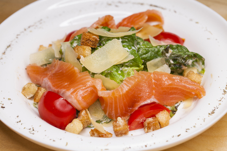 Restaurant dish. Caesar Salad plate with salmonの写真素材