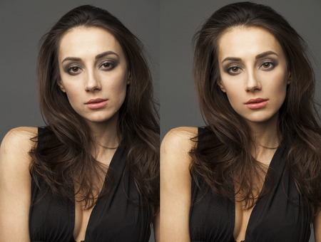 Female face before and after retouch on dark wall studio backgroundの写真素材
