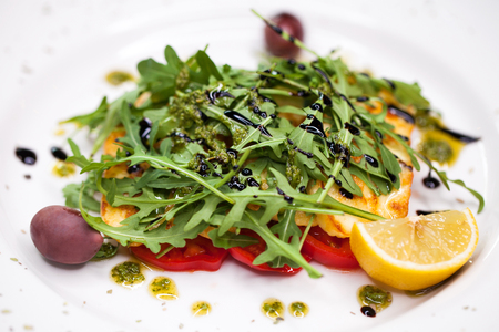 Salad with rucola grilled cheese and tomatoの写真素材
