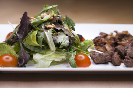 Salad with arugula and fried mushrooms and with liverの写真素材