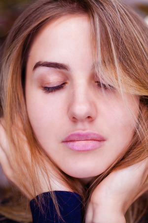 Portrait of a young serious woman without makeupの写真素材