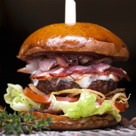 Fast food closeup with traditional tasty hamburgerの写真素材