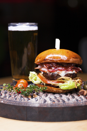 Fast food closeup with traditional tasty hamburgerの写真素材