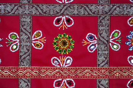 Homemade embroidery on red leather