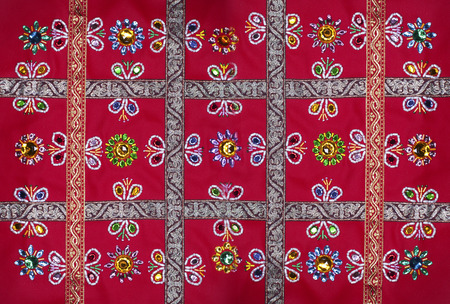 Homemade embroidery on red leather